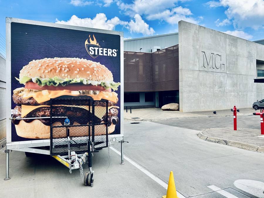 Flame Grilled Events trailer with burger branding