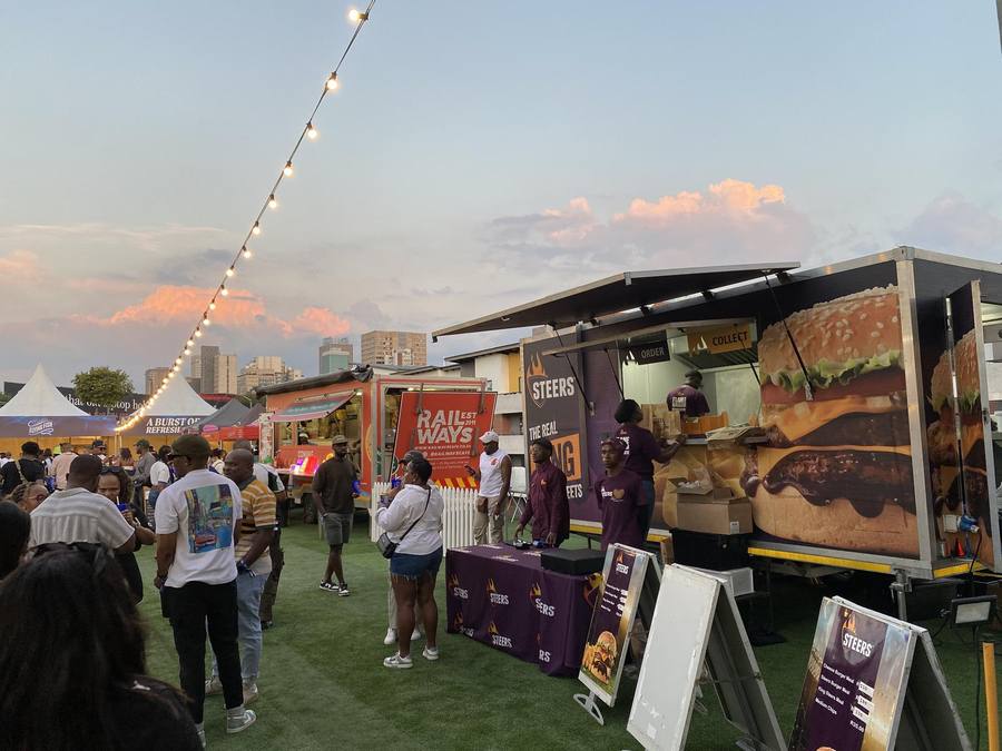 Guests queuing at the trailer in the evening