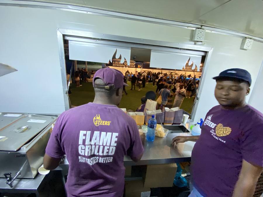 Crew serving from inside the trailer kitchen