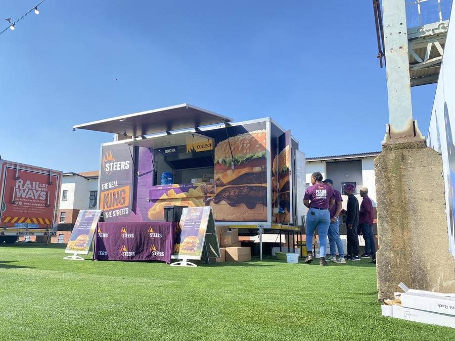 Trailer set up on a venue lawn before gates open